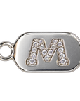 Silver diamond encrusted letter M tag