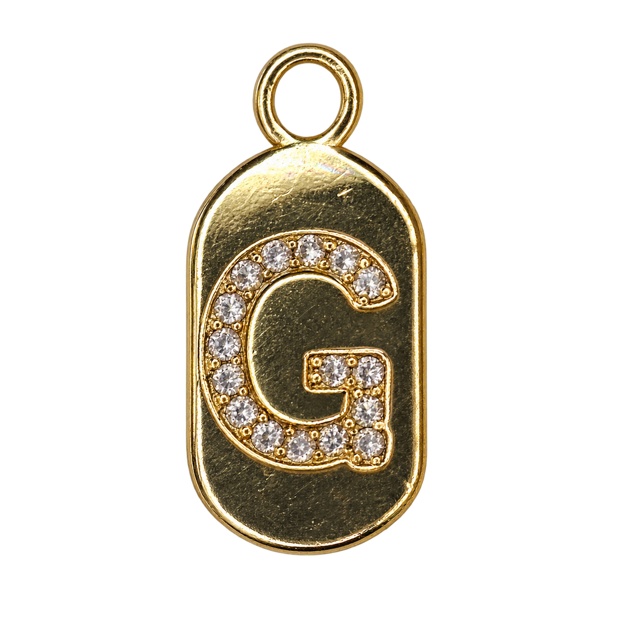 Gold diamond encrusted letter G tag