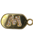 Gold diamond encrusted letter M tag