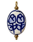 Flat oval blue floral ceramic charm on transparent background