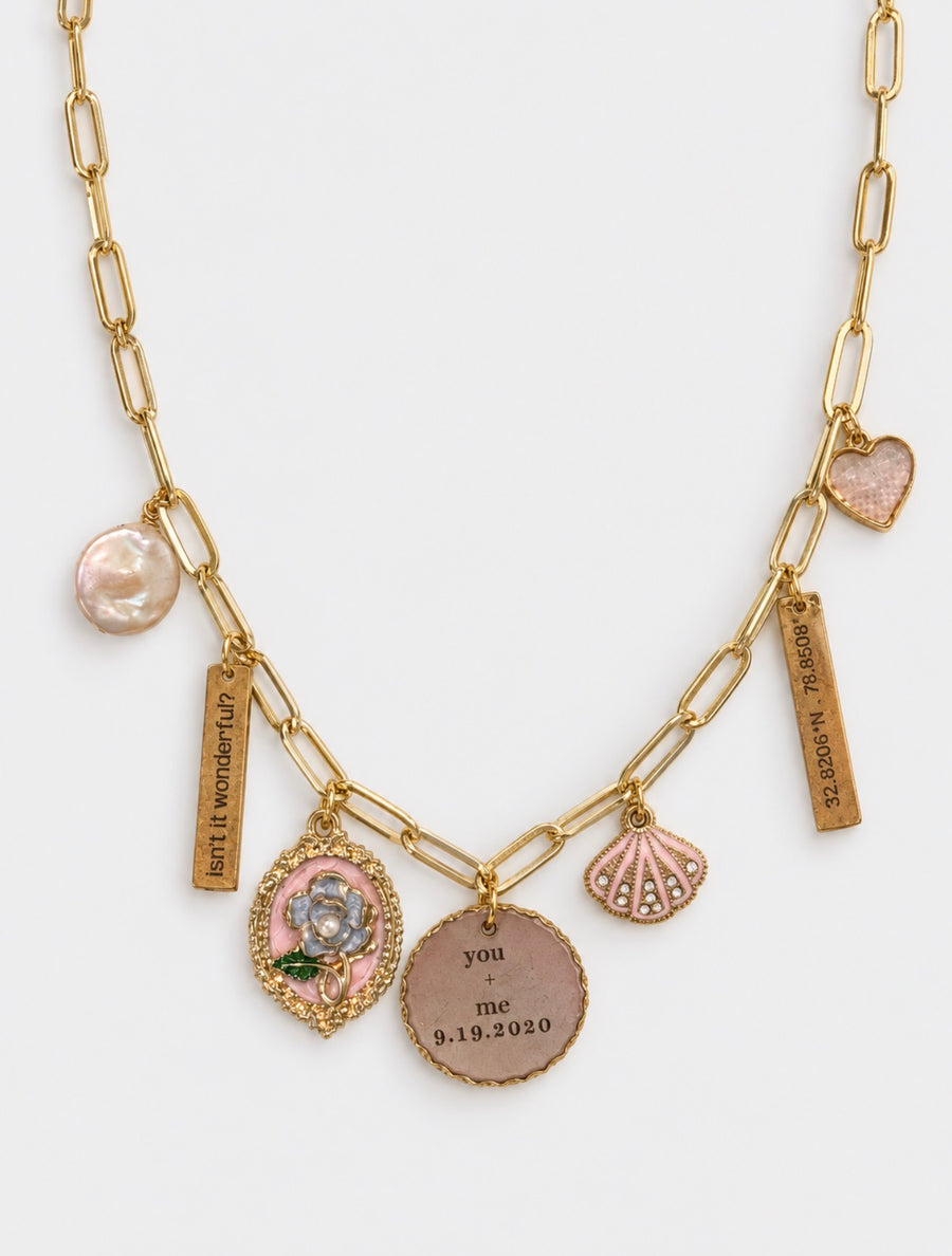 Gold necklace with pink charms and personalized engraved pendants
