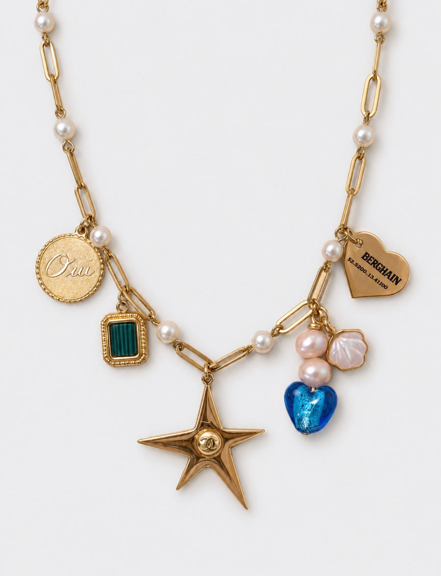 Gold and pearl charm necklace with engraved heart and star pendant