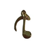 Gold Filled musical note charm on transparent background