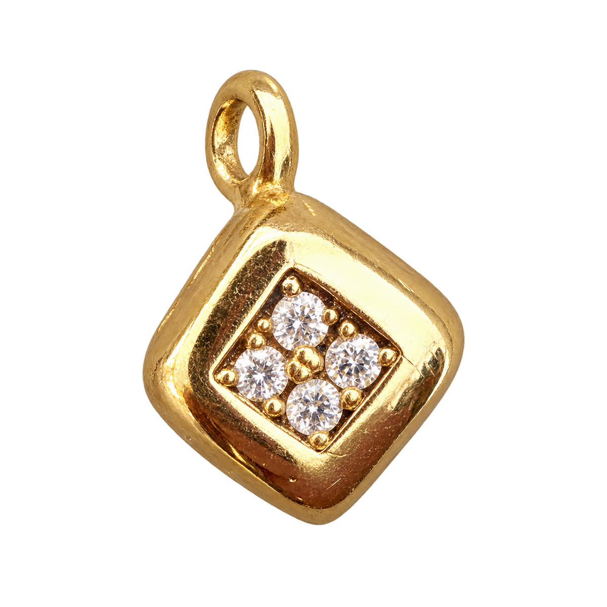 Gold plated dice charm with four clear stones and a gold loop