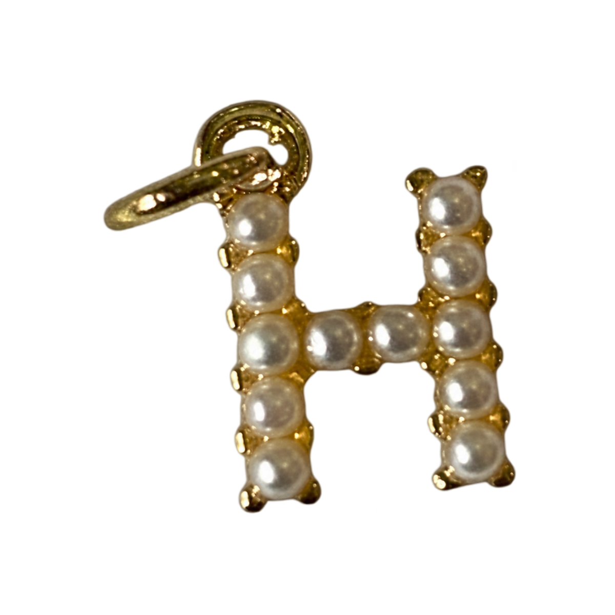 Gold pearl letter H charm on transparent background