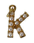 Gold pearl letter K charm on transparent background