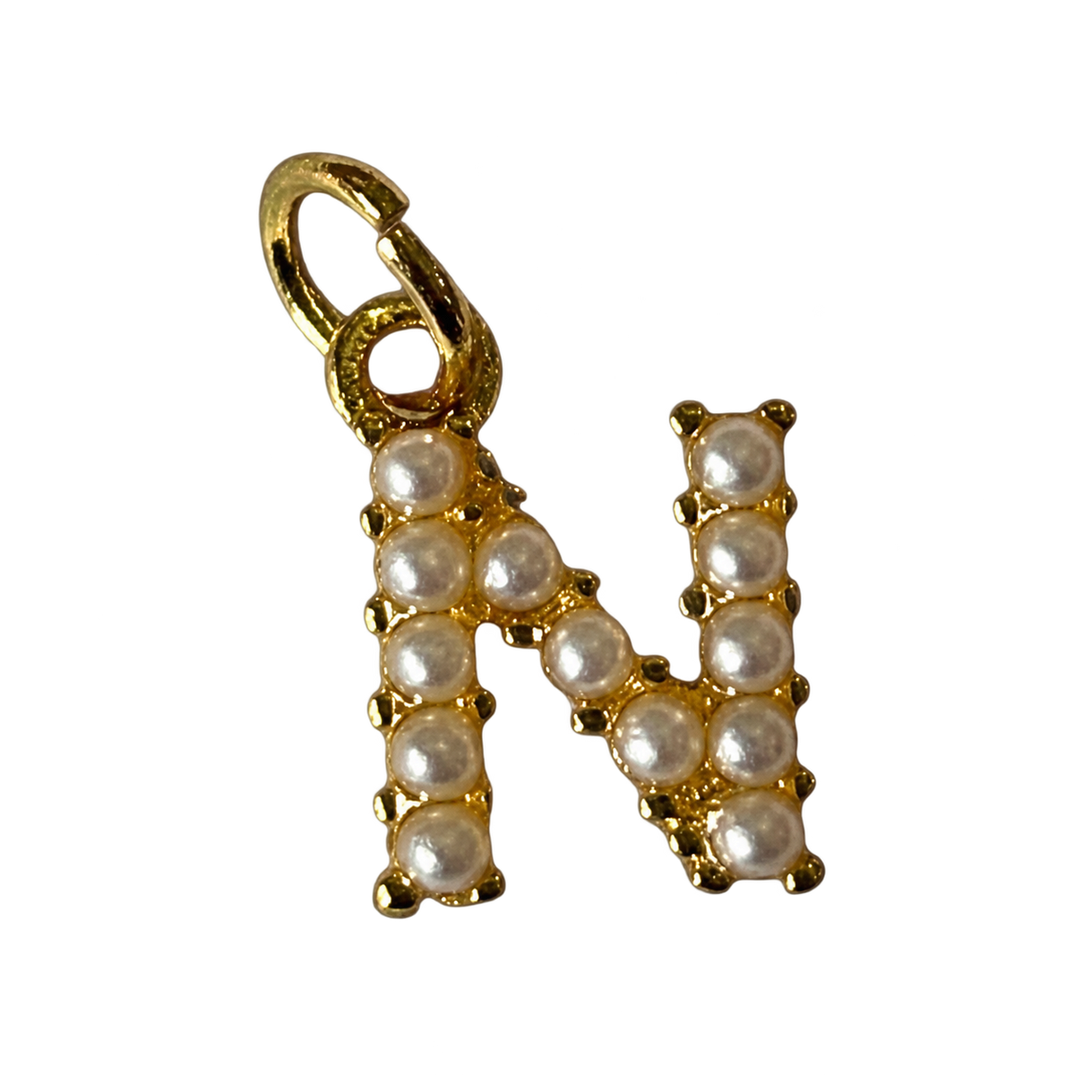 Gold pearl letter N charm on transparent background